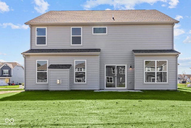 rear view of house with a lawn