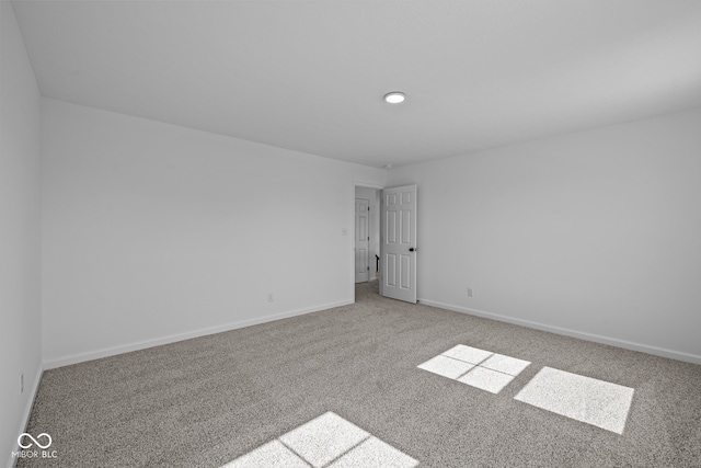 empty room with light colored carpet