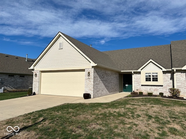 single story home featuring a garage and a front lawn