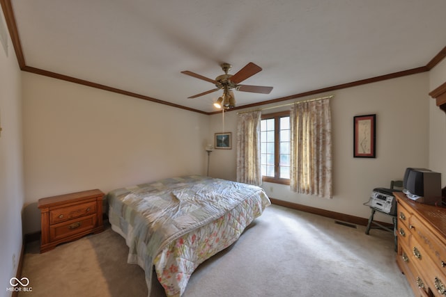 bedroom featuring ceiling fan, light colored carpet, and crown molding