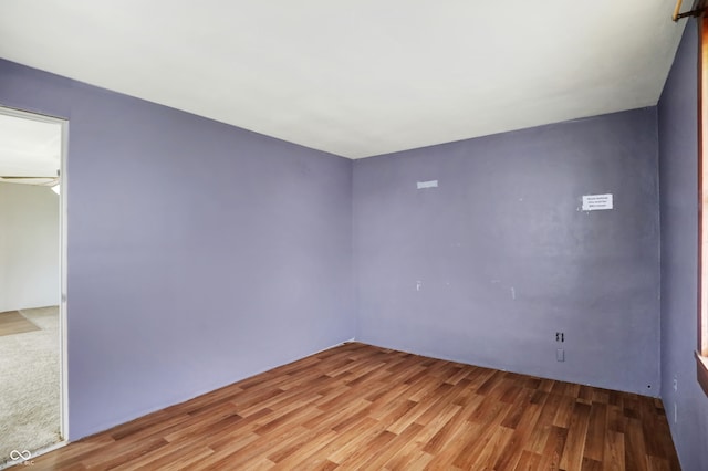 unfurnished room with light wood-type flooring