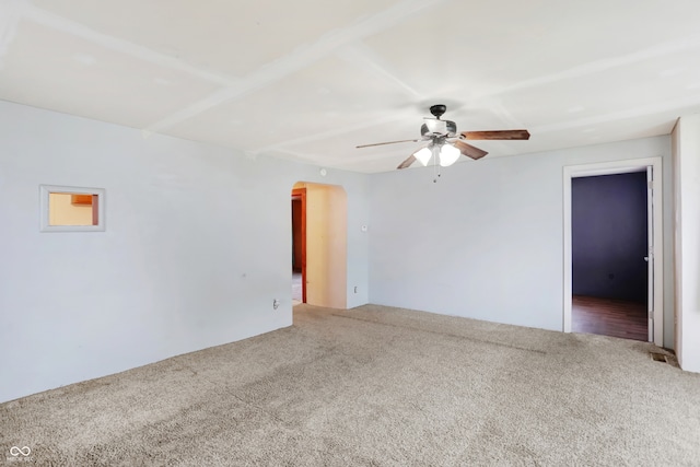 empty room with ceiling fan and carpet floors