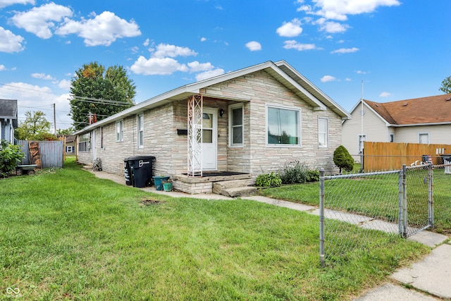 view of front of home with a front lawn