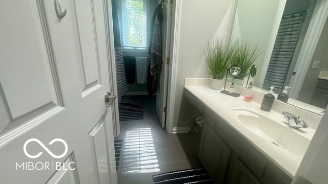 bathroom with vanity and tile patterned floors