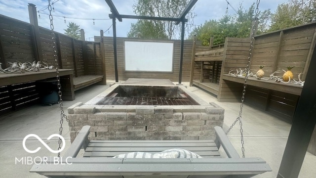 view of patio featuring an outdoor fire pit