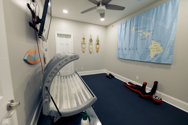 exercise room featuring ceiling fan