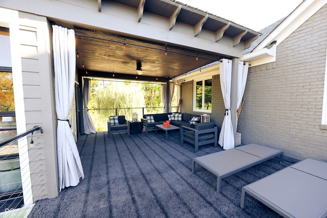 deck featuring outdoor lounge area and ceiling fan