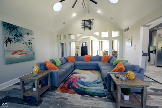 living room featuring beam ceiling, high vaulted ceiling, and ceiling fan