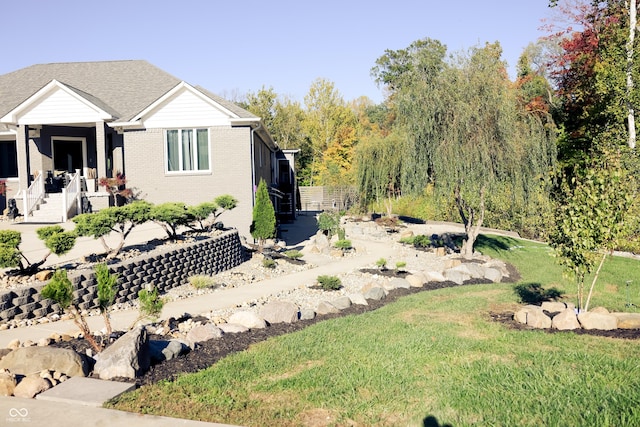 4270 Victoria Ln, Avon, IN 46123 - view of front facade with a front yard and brick siding