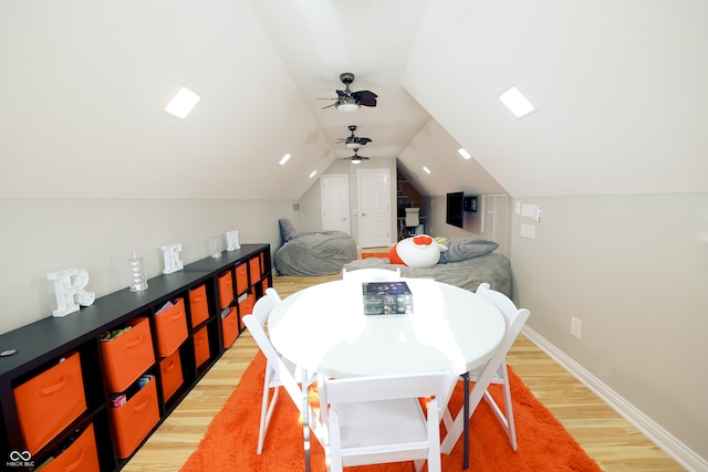 dining space with lofted ceiling, light hardwood / wood-style floors, and ceiling fan