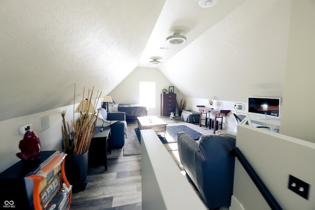 4270 Victoria Ln, Avon, IN 46123 - living area featuring wood finished floors, vaulted ceiling, and a textured ceiling