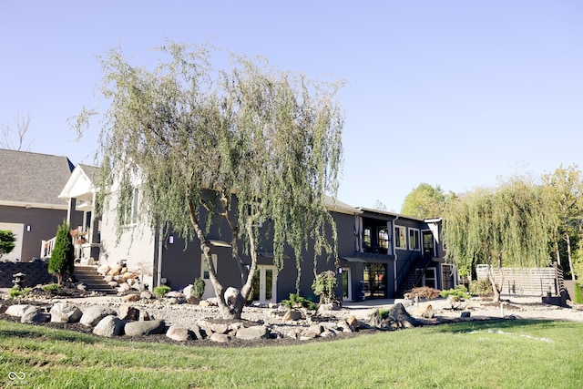 view of side of home featuring a yard