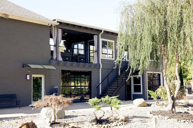 exterior space featuring a balcony and a patio area