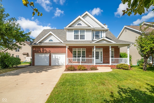 view of front of property featuring a garage, a front lawn, and covered porch