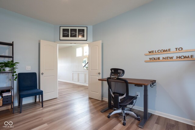 office with light hardwood / wood-style floors