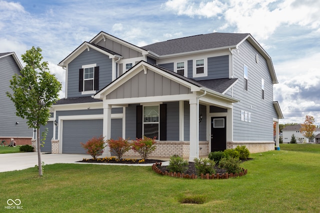 craftsman house with a front yard, a garage, and covered porch