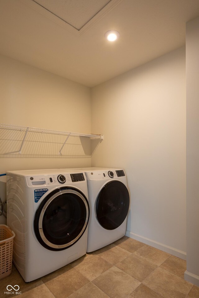 clothes washing area featuring separate washer and dryer