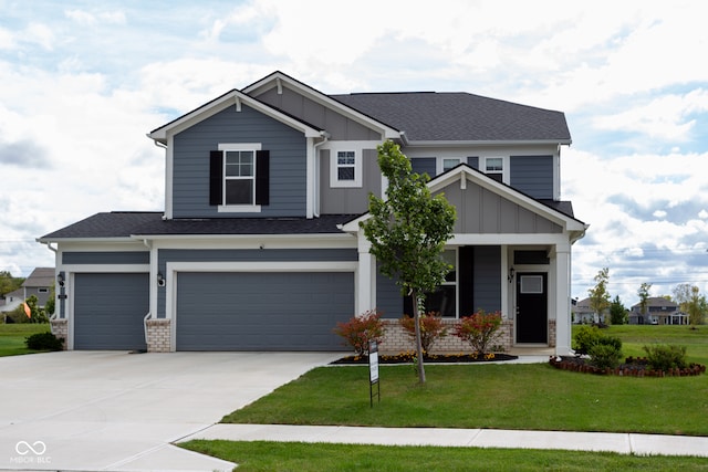 craftsman inspired home featuring a front yard and a garage