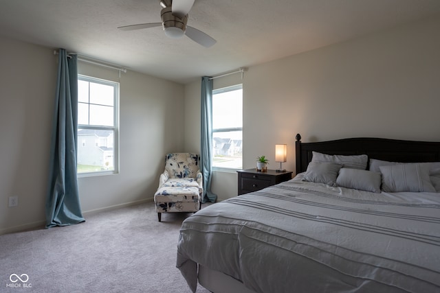 bedroom featuring ceiling fan and light colored carpet