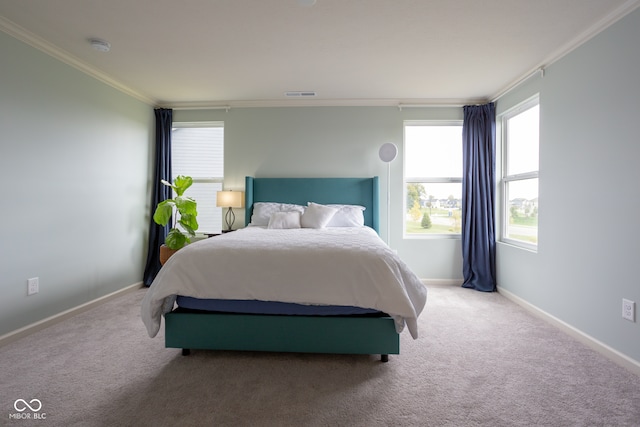 bedroom with carpet and crown molding