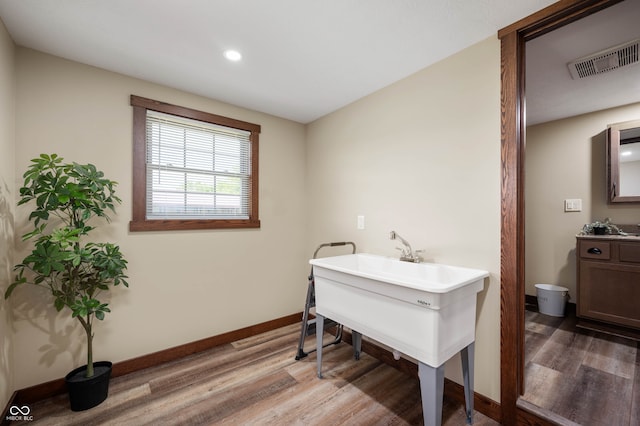 bathroom featuring vanity and hardwood / wood-style flooring