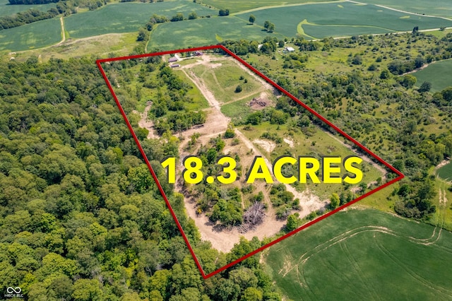 birds eye view of property with a rural view