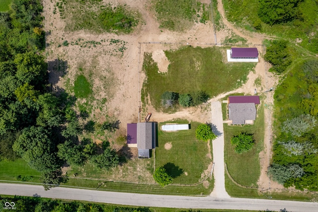 birds eye view of property with a rural view