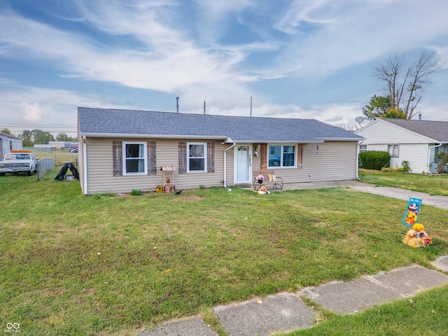 ranch-style house featuring a front yard