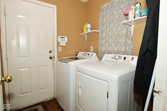 clothes washing area featuring washer and clothes dryer