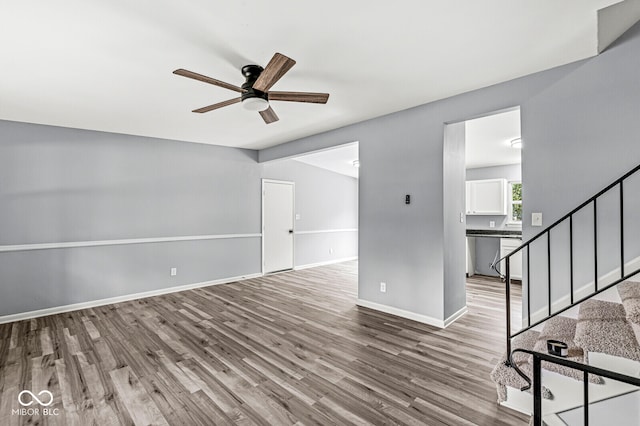 empty room featuring hardwood / wood-style floors and ceiling fan