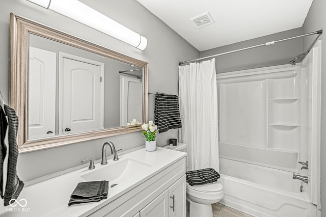 full bathroom with shower / tub combo with curtain, vanity, toilet, and tile patterned floors