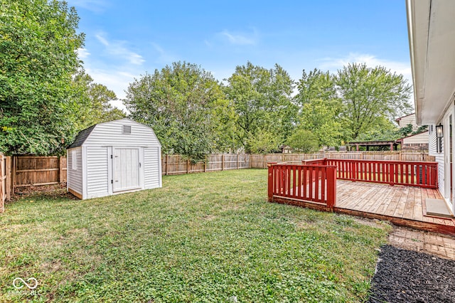 view of yard with a deck and a shed