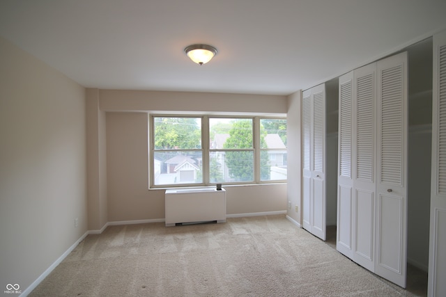 unfurnished bedroom with light carpet