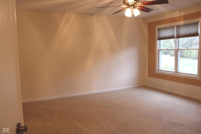 spare room with carpet flooring and ceiling fan