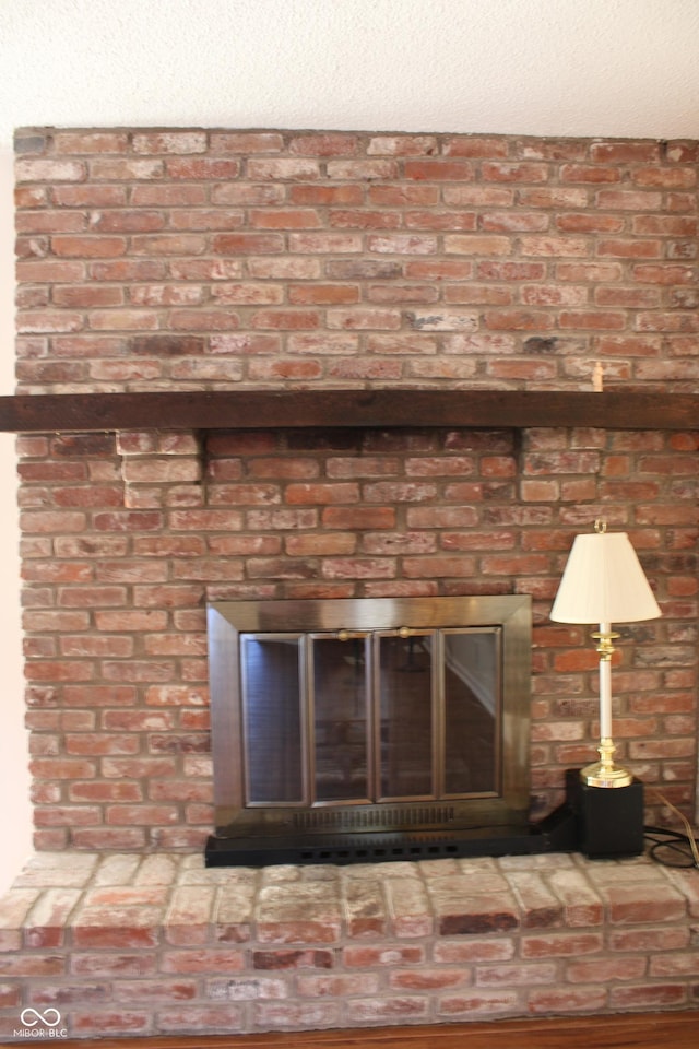 details with a brick fireplace