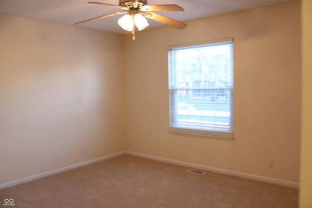 unfurnished room with carpet and ceiling fan