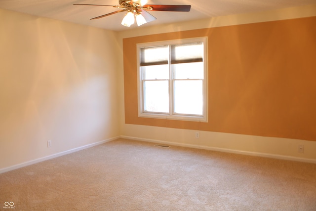 unfurnished room with carpet floors and ceiling fan