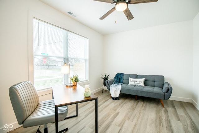 office space featuring light hardwood / wood-style floors and ceiling fan