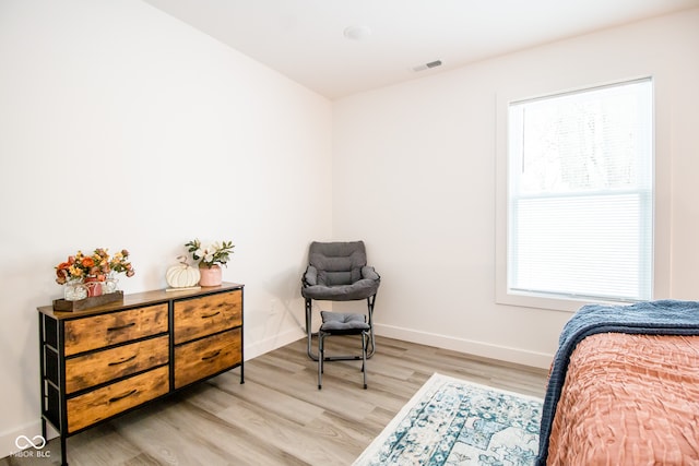 bedroom with light hardwood / wood-style flooring