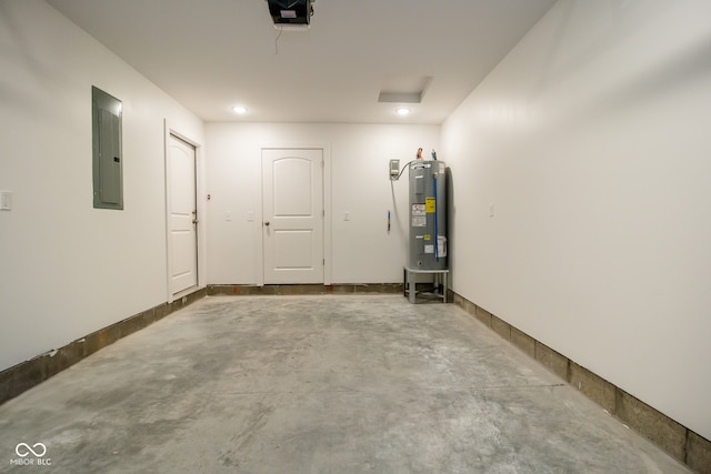 garage with electric water heater, electric panel, and a garage door opener