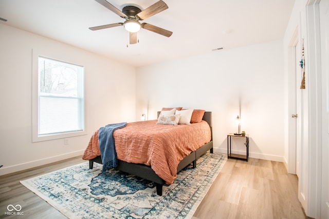 bedroom featuring ceiling fan and light hardwood / wood-style flooring