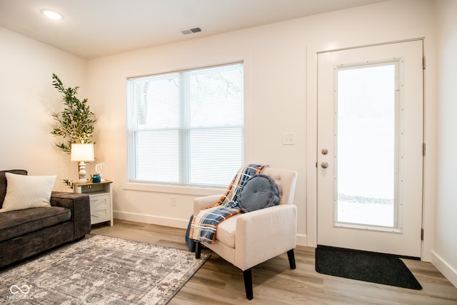 sitting room featuring light hardwood / wood-style flooring and a healthy amount of sunlight