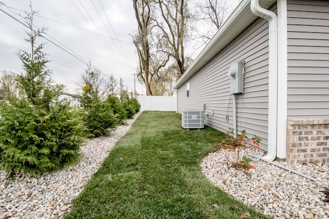 view of yard featuring central air condition unit