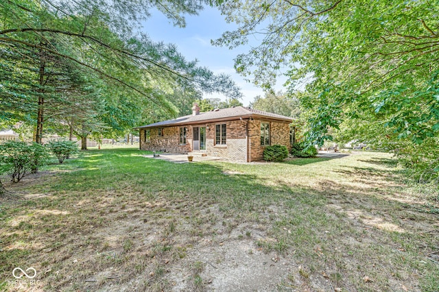 view of home's exterior with a yard