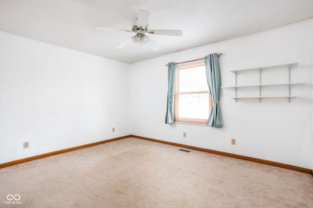 unfurnished room featuring carpet floors and ceiling fan