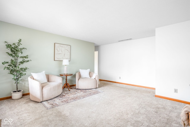 sitting room with carpet flooring