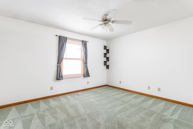 unfurnished room featuring carpet flooring and ceiling fan