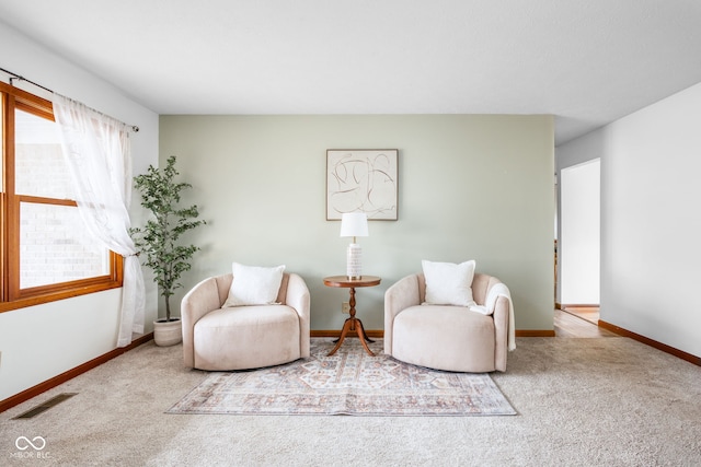 living area with light carpet