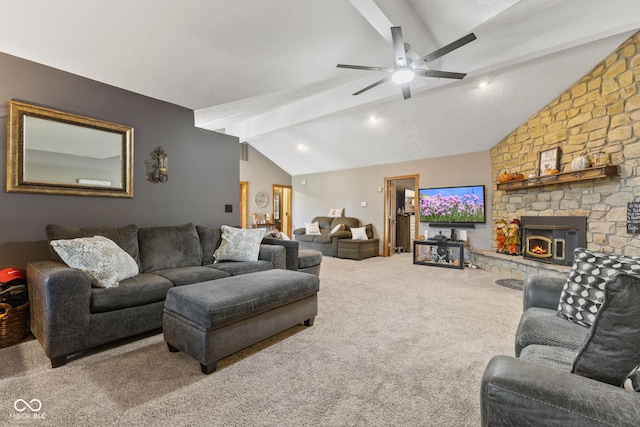 living room with ceiling fan, a fireplace, lofted ceiling with beams, and carpet