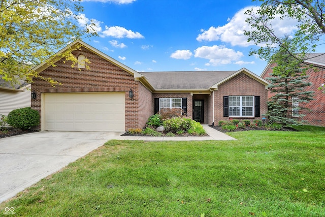 view of front of property with a garage and a front lawn